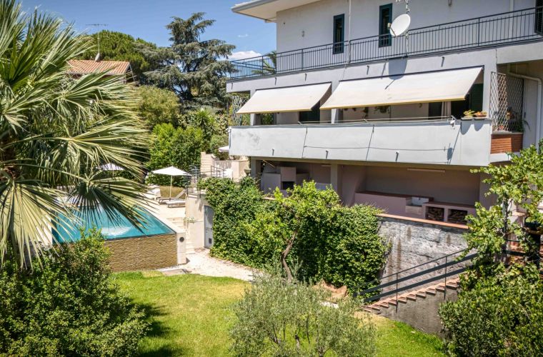 Mediterranean garden and lawn by the pool