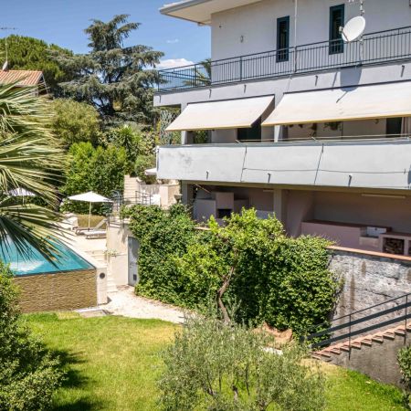 Mediterranean garden and lawn by the pool