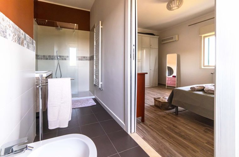 Bathroom with shower in the master bedroom