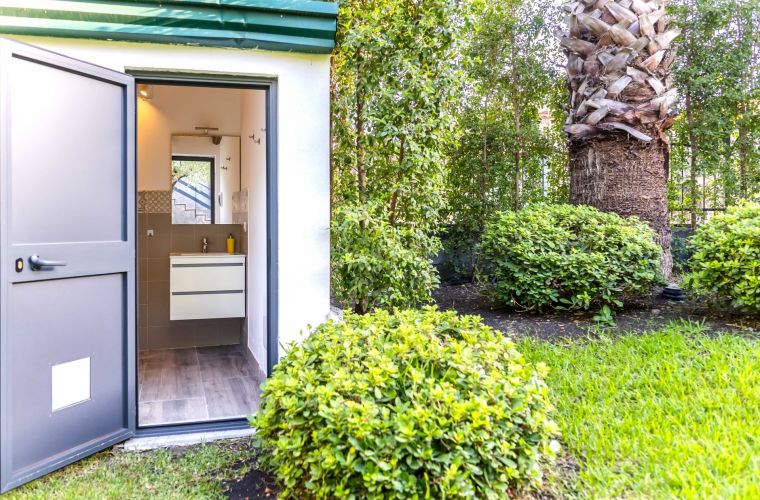 Bathroom with shower by the pool