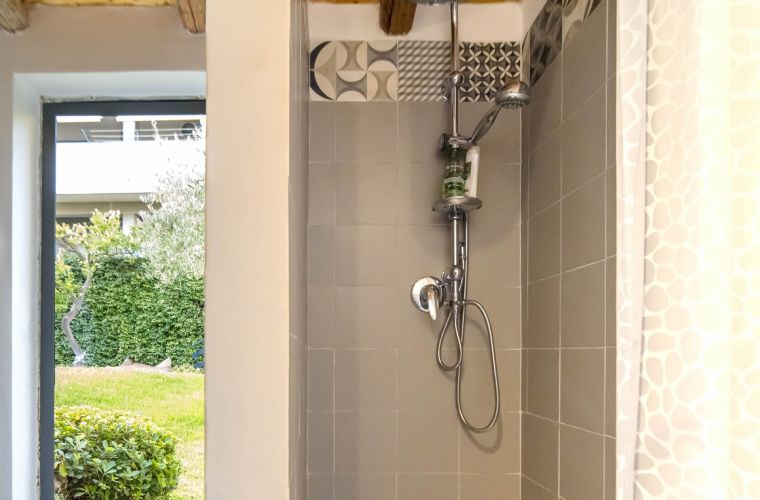 Bathroom with shower by the pool